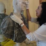 Cleaning a marble bust